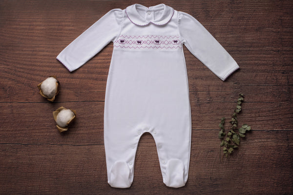 Baby Clothes Footed Jumpsuit in White with Smocked Details of Purple Bows in Pima Cotton