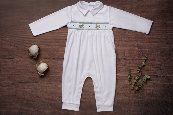 Baby Clothes Footless Jumpsuit in White with Green Smocked Details of Rocking Horses in Pima Cotton